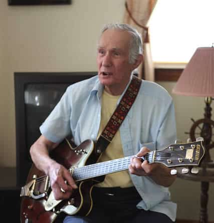 Elderly Man Playing Guitar