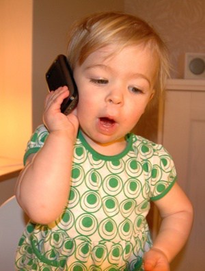Little Girl Playing With Cell Phone